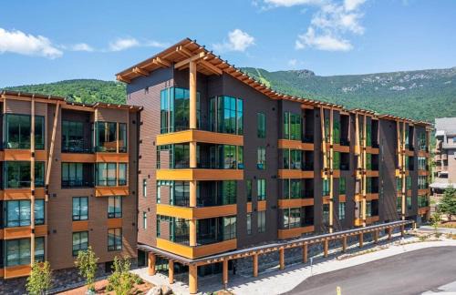 Stowe Area Apartment | 411 Spruce Peak Stowe Mountain Resort New Treehouse unit Ski in Ski out 4 bed sleeps 12