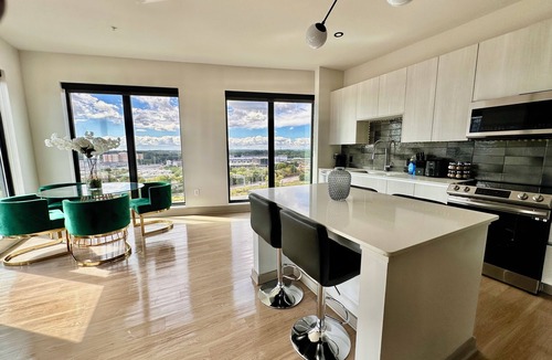Home Park Apartment | Ceiling to floor windows featuring a private balcony with stunning city views!