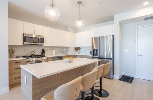 Historic Downtown Apartment | Luxe 2BR Retreat 5-Min PATH to NYC With Rooftop+Gym