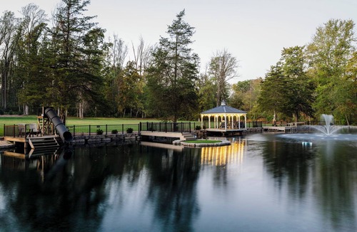 Honey Brook House | Outdoor Oasis with pickleball, swimming pond, basketball, shuffleboard & pavilion with kitchen