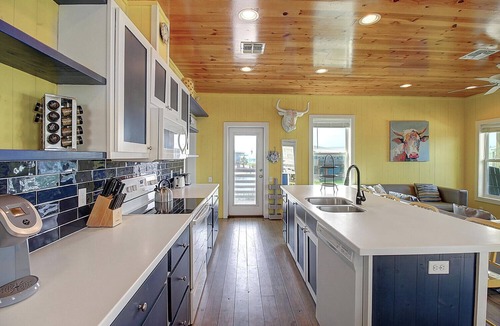 Port Aransas House | Situated on the stock pond at Ocean Village, adjacent to the neighborhood pool a