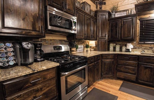 Hochatown Cabin | Soaring cathedral ceilings, gas rock fireplace, large hot tub, smart tv, games.