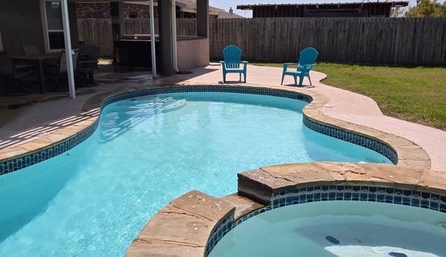 A family-friendly retreat featuring a pool, hot tub, and spacious outdoor area.