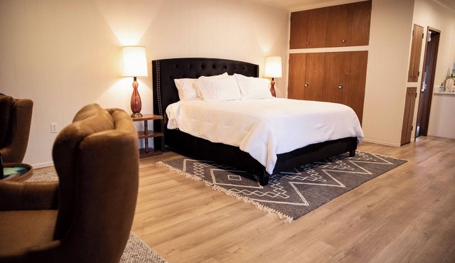 Suite 105 freatures a private outdoor-covered balcony.